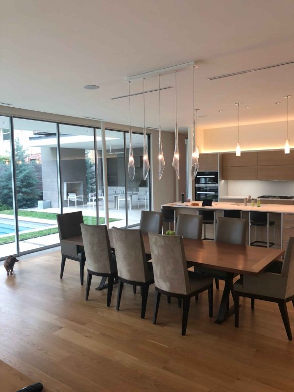 After Picture of the Living Room/Pool Area - Dining area and view of pool